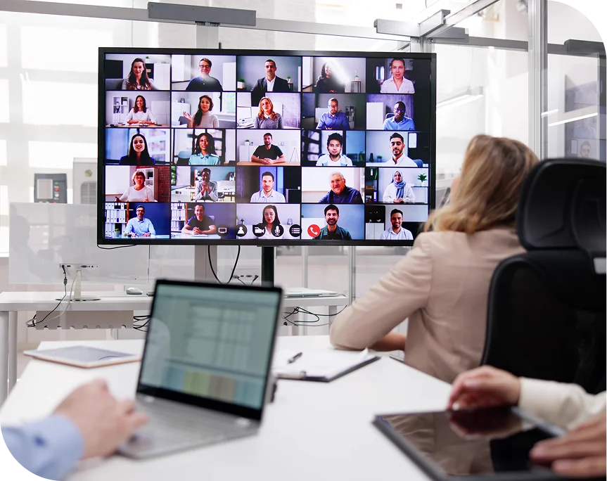 Office workers on large video conference screen