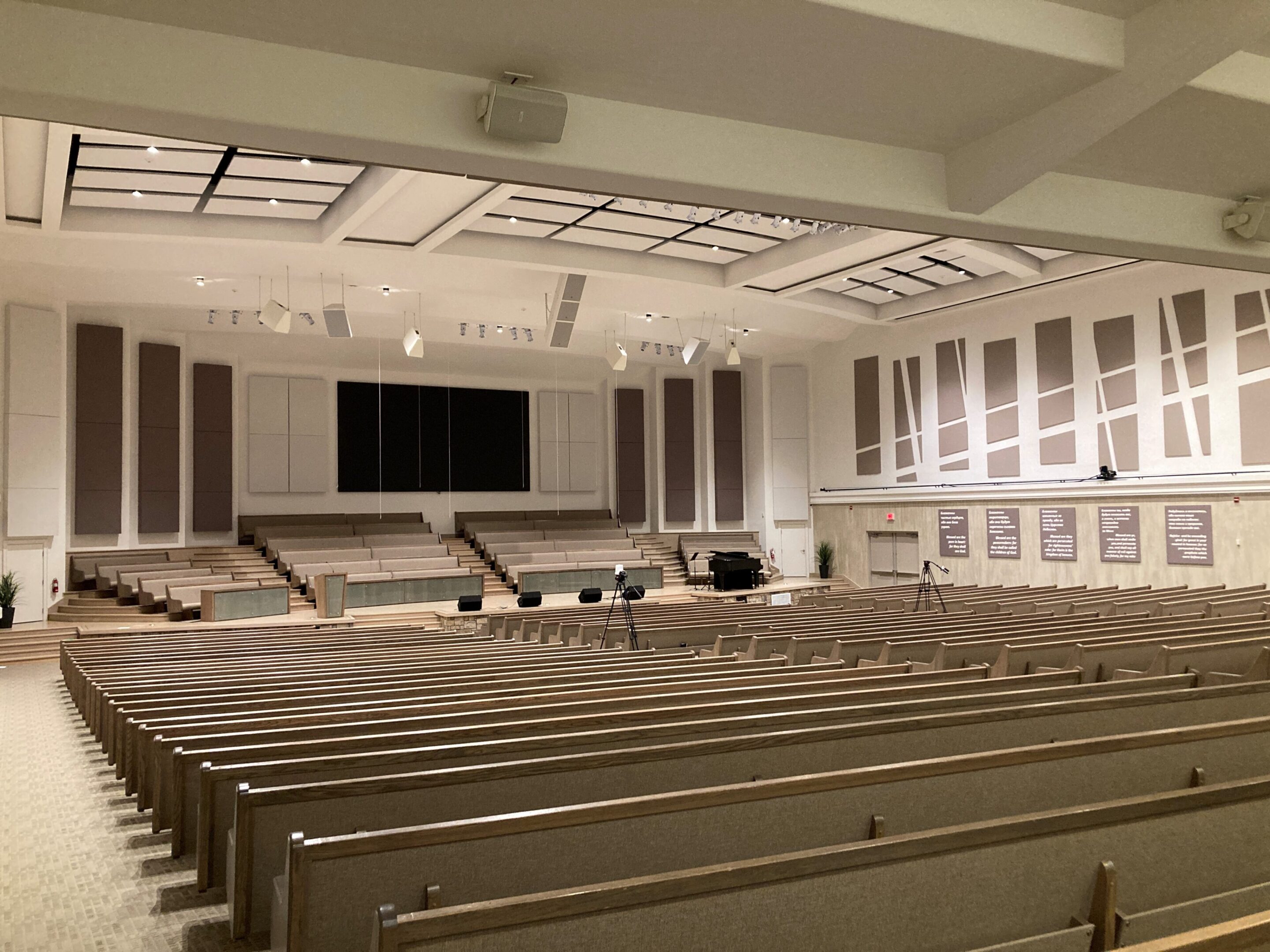 Empty church sanctuary with stage and pews